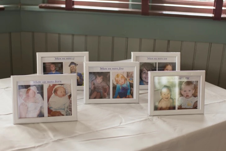 Framed childhood photos displayed on the reception table
