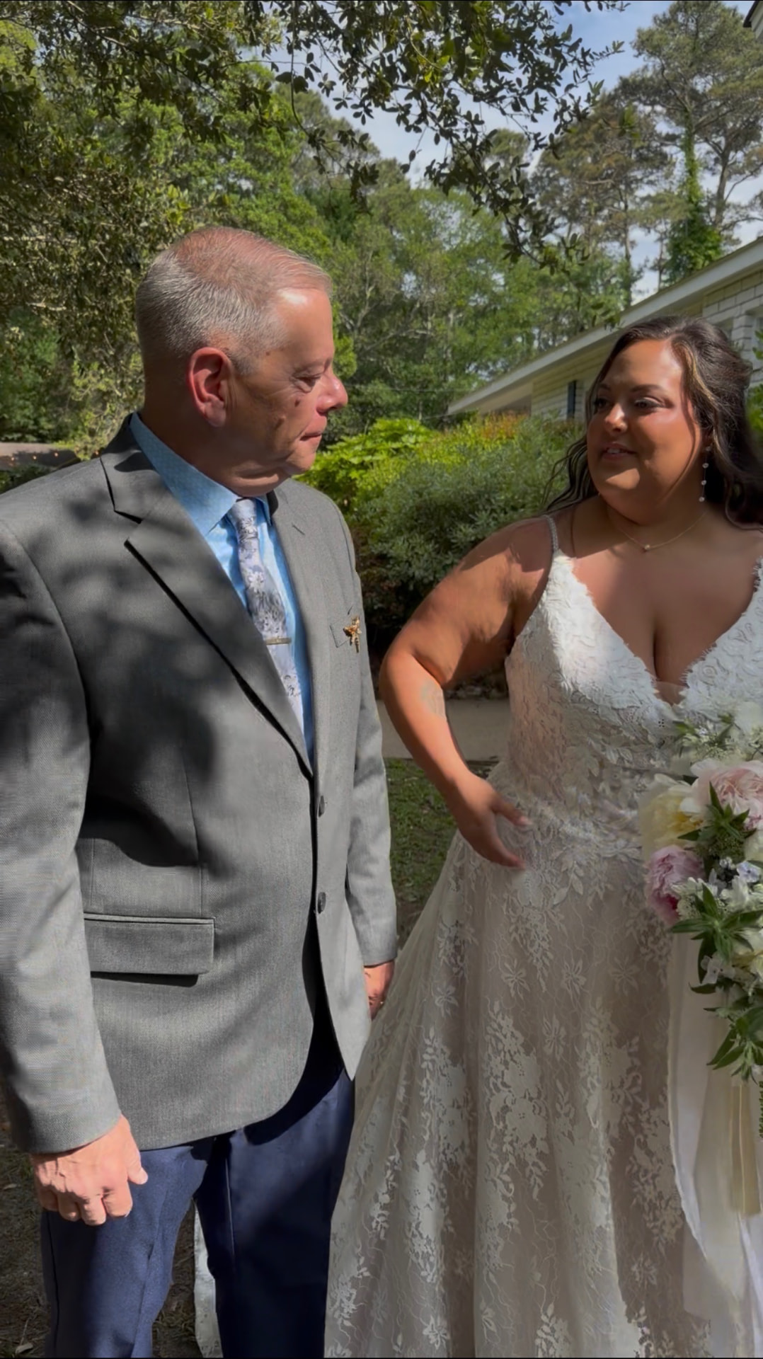 Father and bride sharing a moment before the ceremony